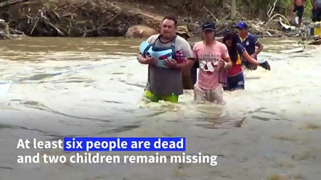 Bolivians forced to wade through deadly floods