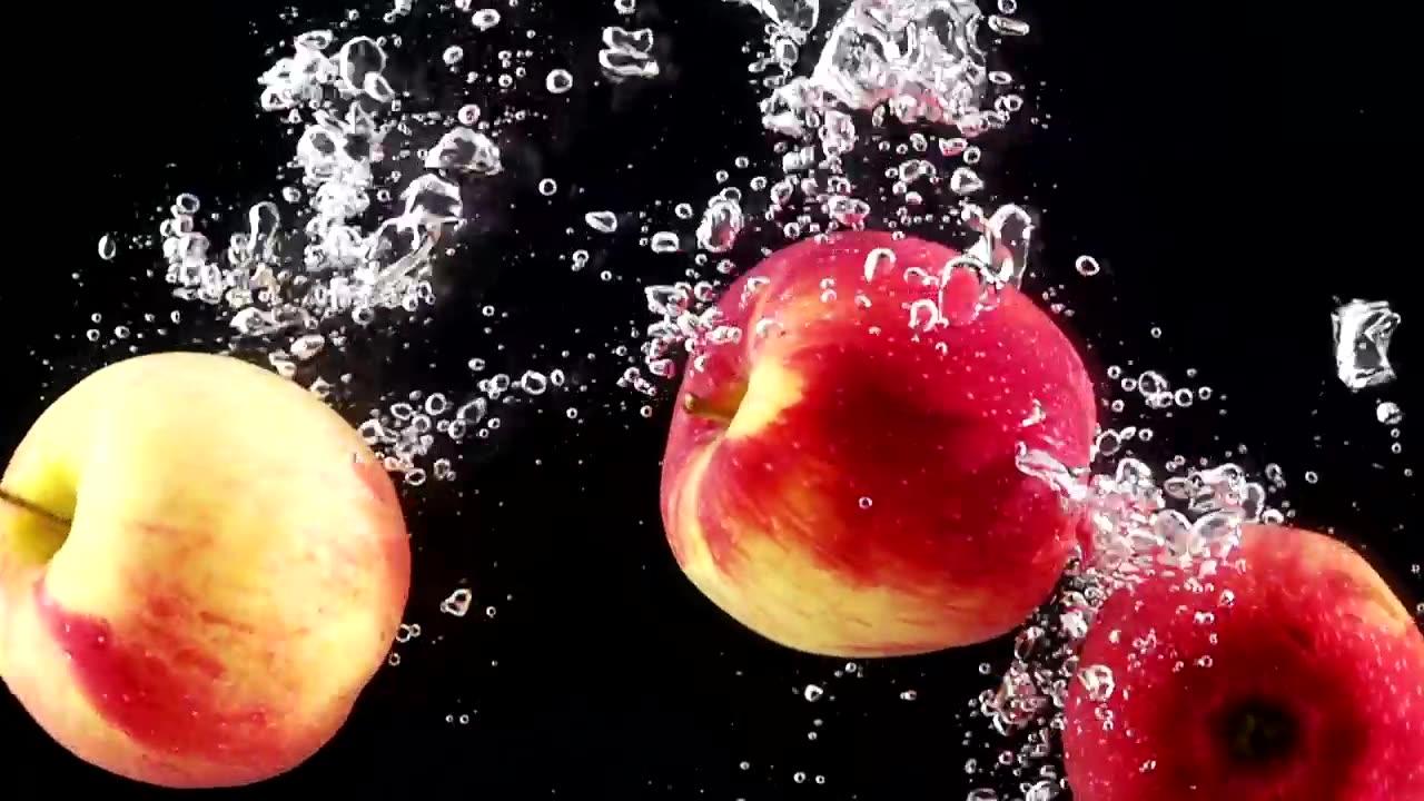 Apples falling through water