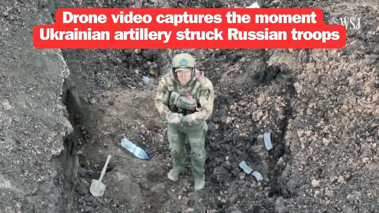 Drone video captures the moment Ukrainian artillery struck Russian troops