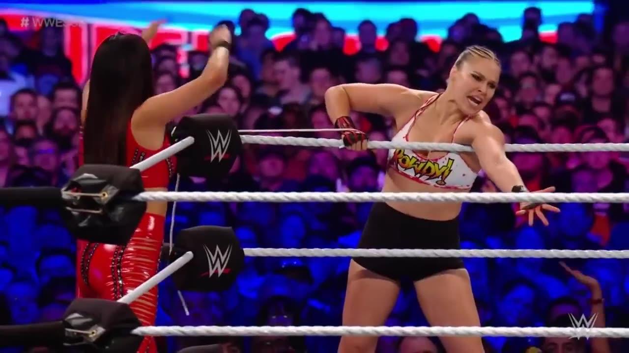 Ronda Rousey and Nikki Bella vs the riotte squad for the Raw women champions Wwe