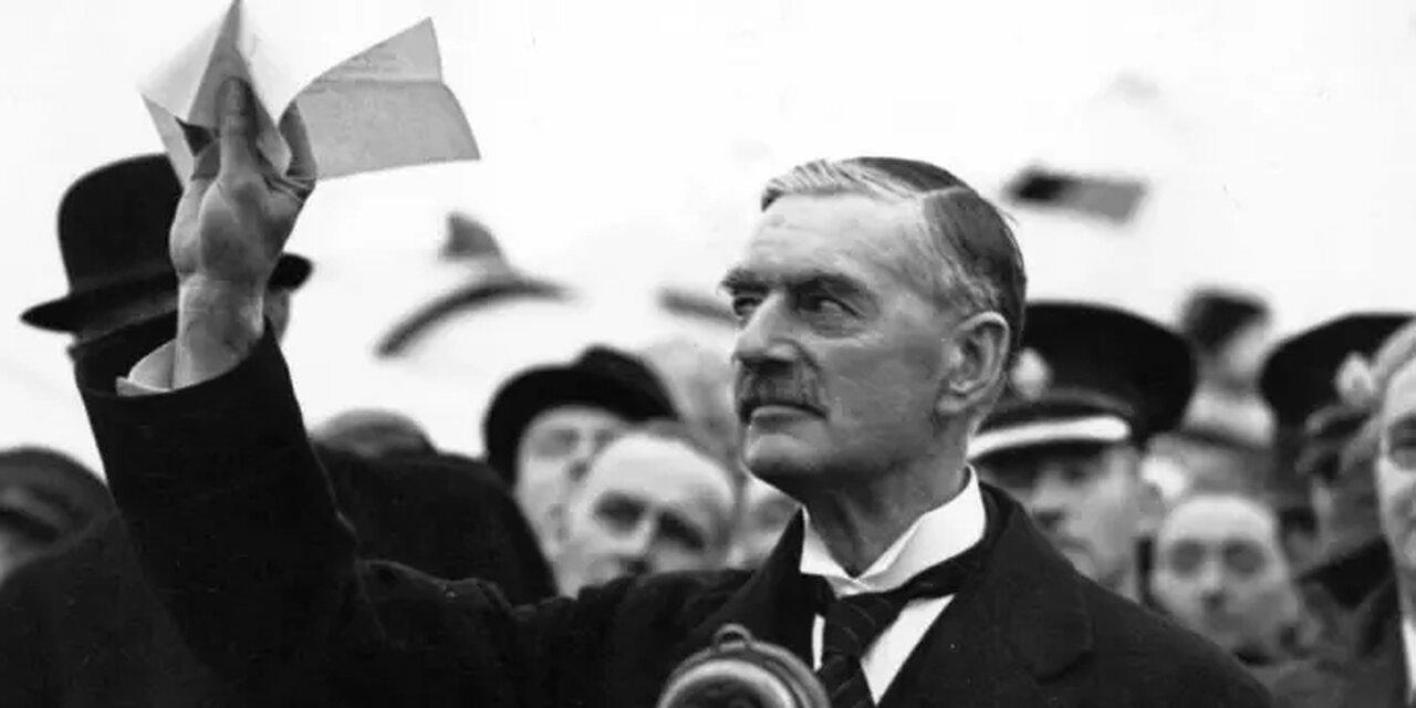 Neville Chamberlain returns from Germany with the Munich Agreement