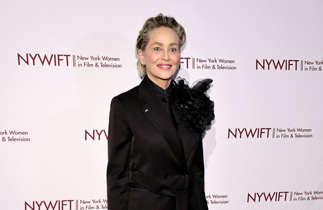 Sharon Stone says being famous is a drag as she has to keep picking up $3,000 dinner tabs