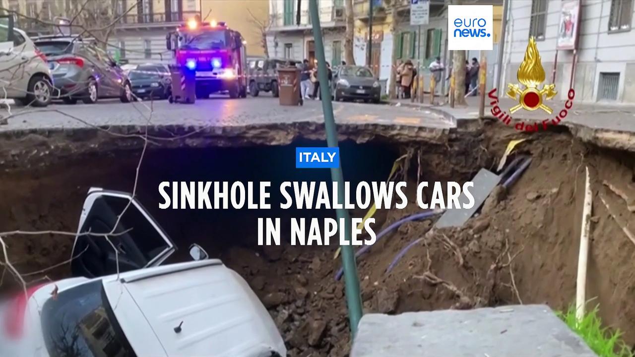 Huge sinkhole in Naples swallows two cars