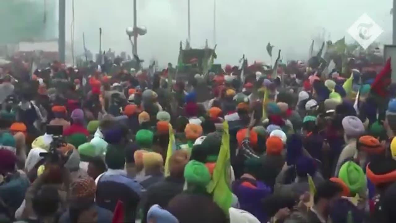 Indian police fire tear gas into crowds of protesting farmers
