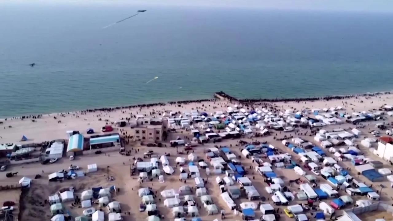 Drone shows people gathering for aid airdrop over Gaza