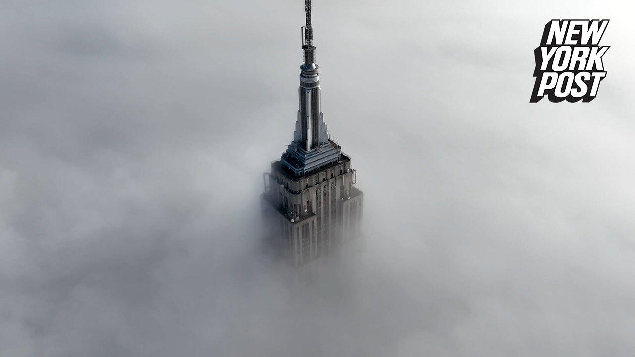 Empire State Building swallowed up by thick fog: drone video