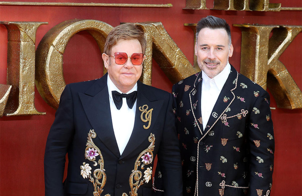 Sir Elton John used to have a cardboard cut-out of his husband and sons in his dressing room