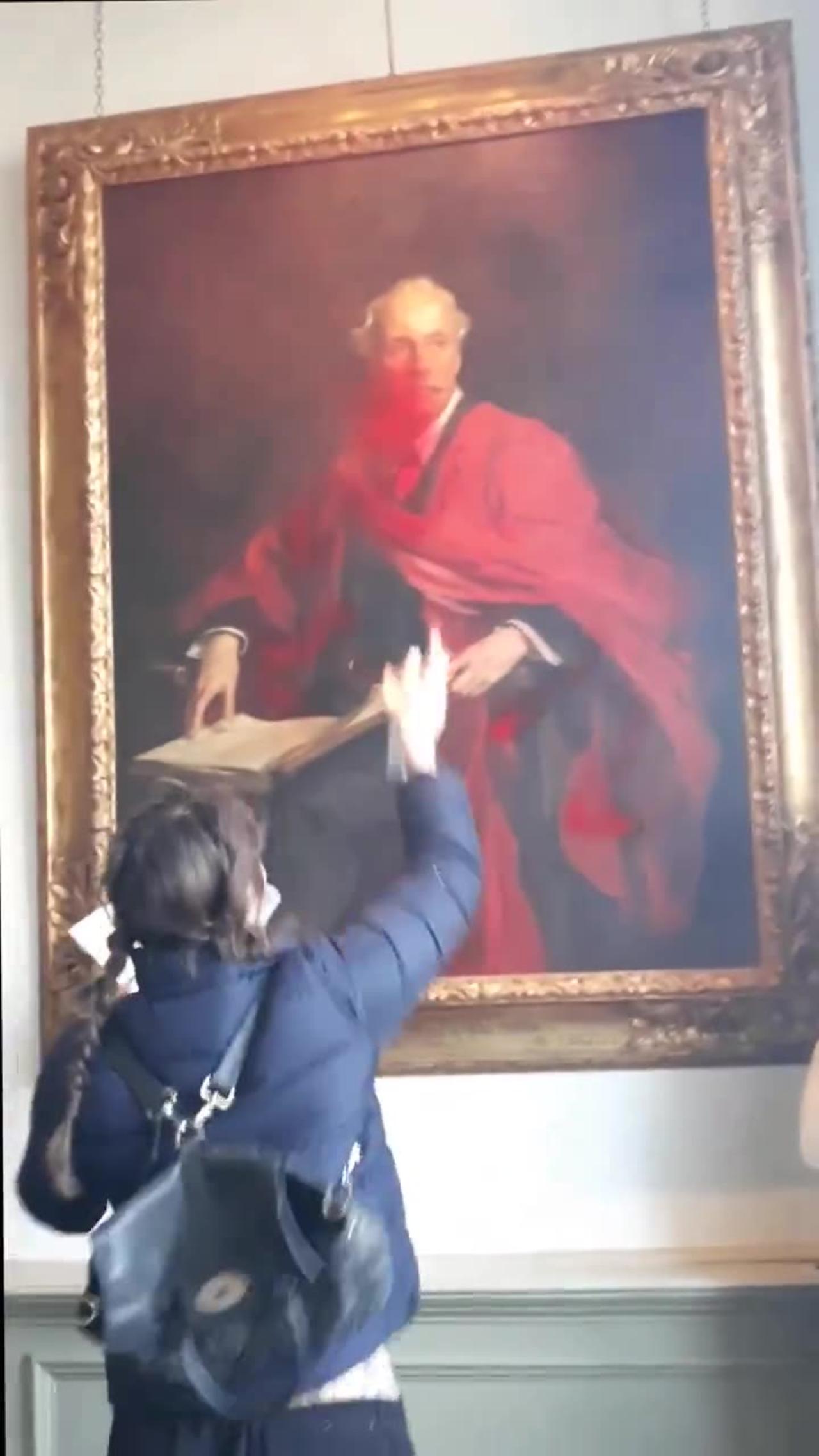 Palestinian Protester Destroys a Painting of Lord Balfour at the University of Cambridge