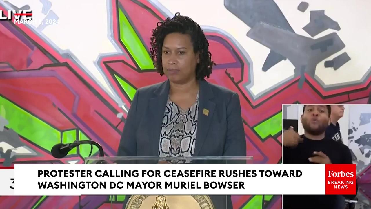 WATCH- Pro-Ceasefire Protester Rushes Toward DC Mayor Muriel Bowser Causing Event To Grind To A Halt