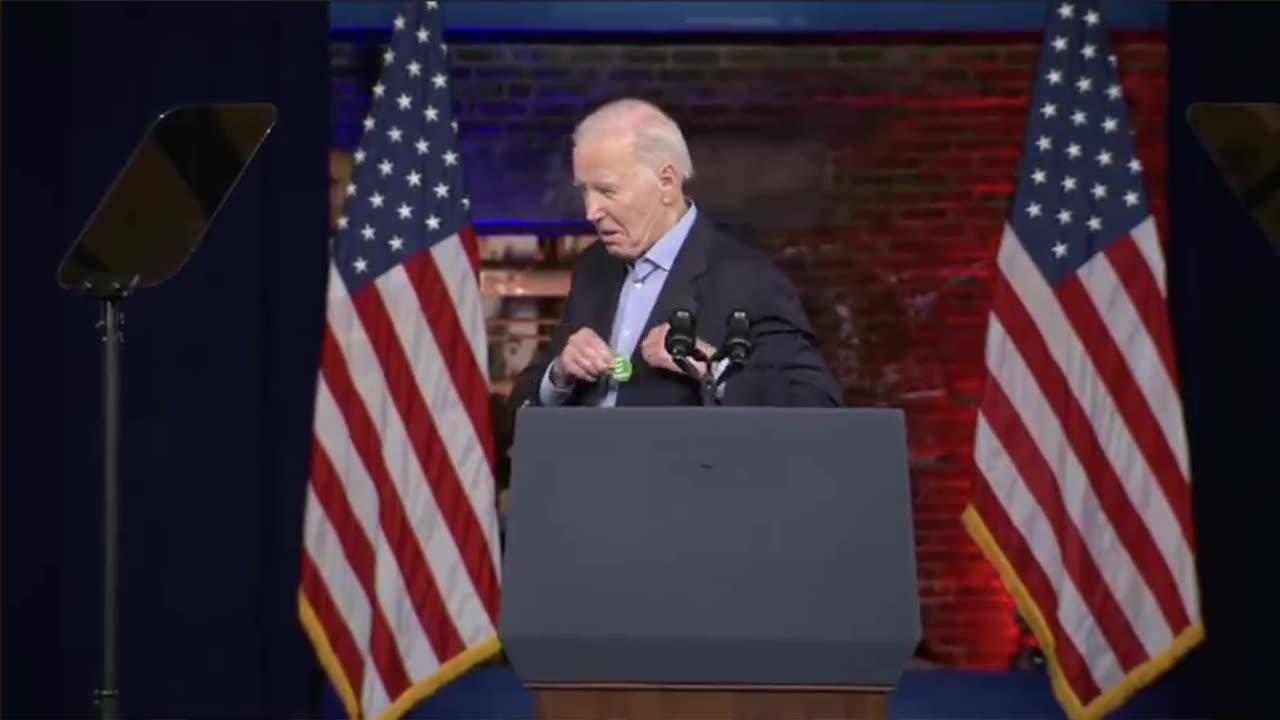 President Biden shows off his new pin to roaring crowd: Regulate guns, not women!