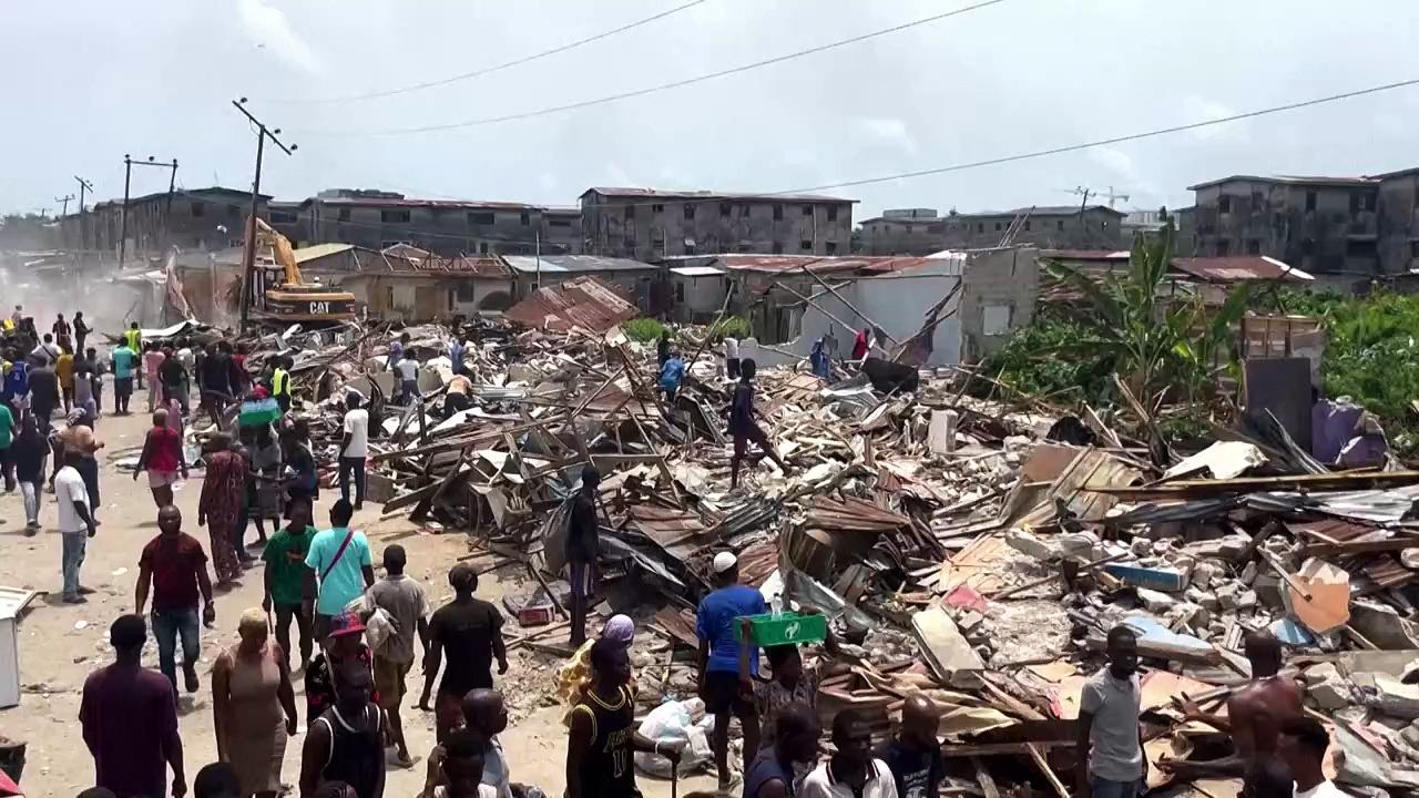 Nigerians look on as their Lagos neighbourhood is razed