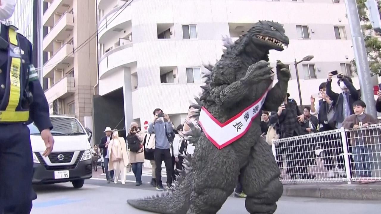 Godzilla Promotes Traffic Safety in Tokyo Stroll