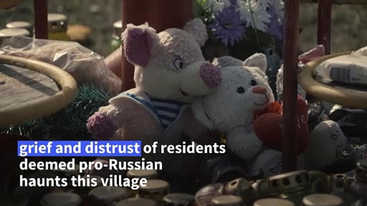 Suspicion haunts grieving Ukrainian village