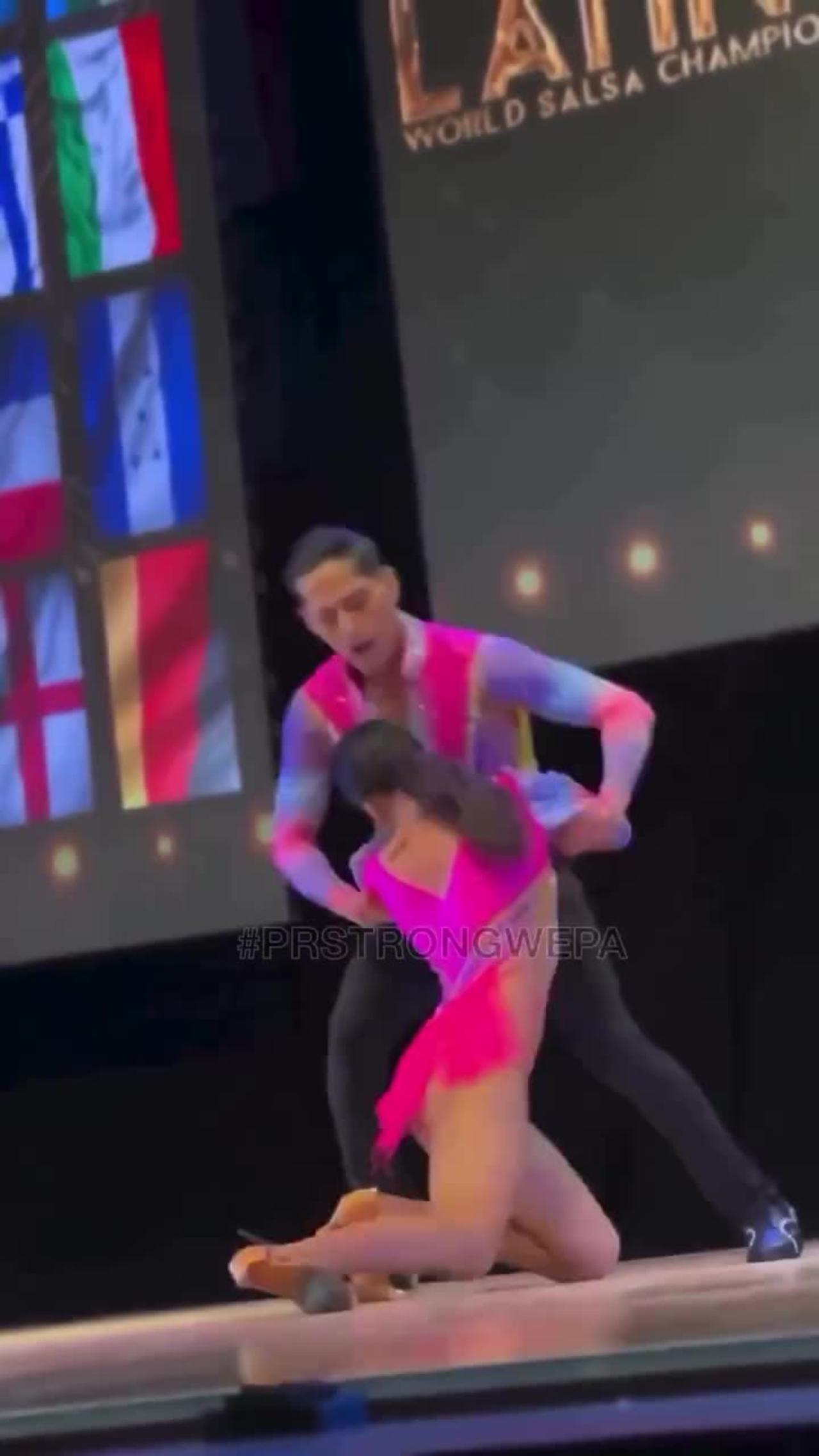 Woman falls in dance contest, keeps smiling