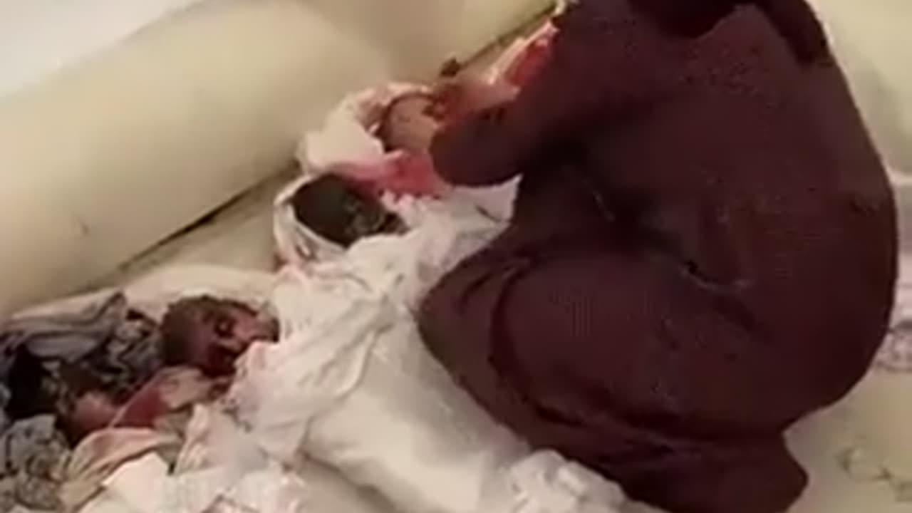 Palestinian paint silicon baby dolls with 'red blood' to portray 'deaths from Israeli airstrikes'
