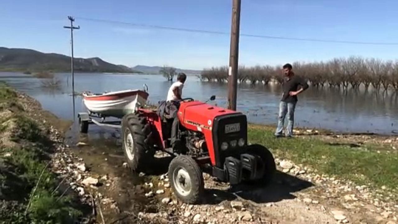 Overflowing Greek lake leaves 'only water and chaos' to farmers