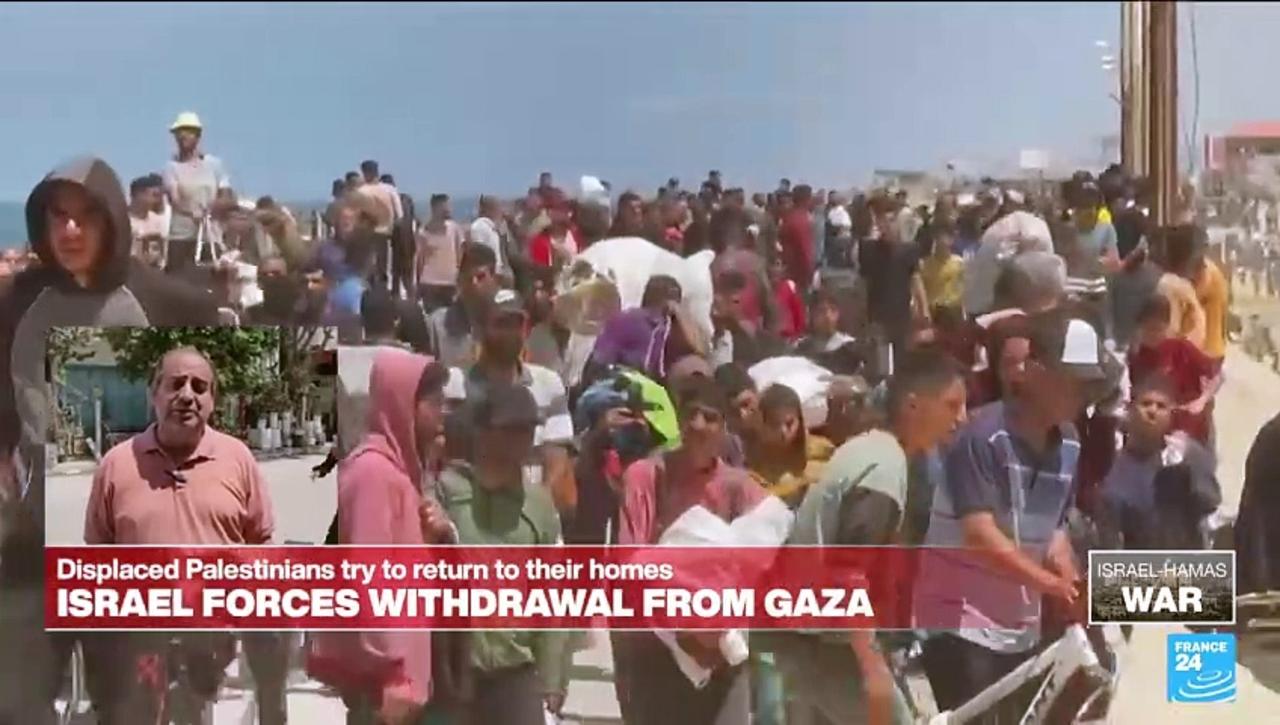 Displaced Palestinians flood road to return to northern Gaza