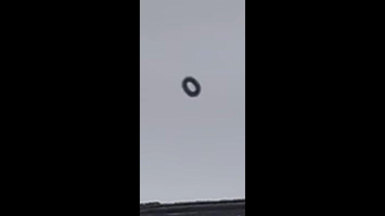 UFO Unveiled: Behold 'The Black Doughnut' - A Captivating Extraterrestrial Encounter!