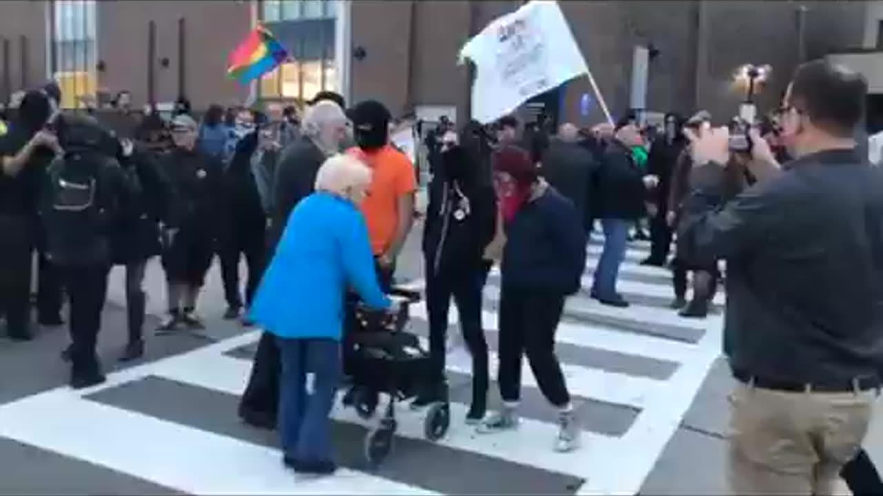 Antifa terrorizing  an elderly and frail couple for trying to simply cross the street,