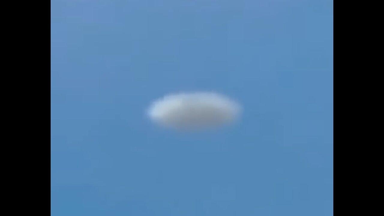 White Disc UFO Filmed from Plane  over Denver