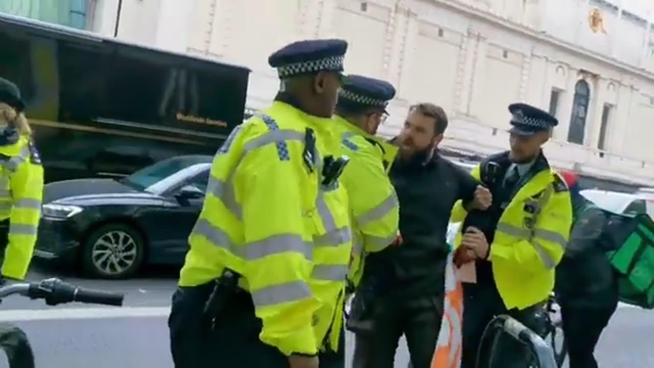 Useless UK police let "Just Stop Oil" protesters Block Road then Arrest Man for taking their Banner!