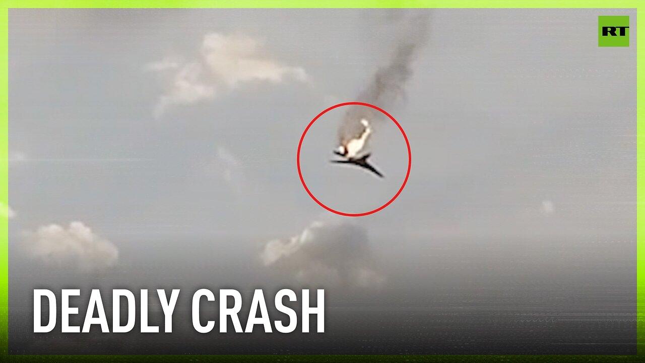 Russian military plane crashes down in flames