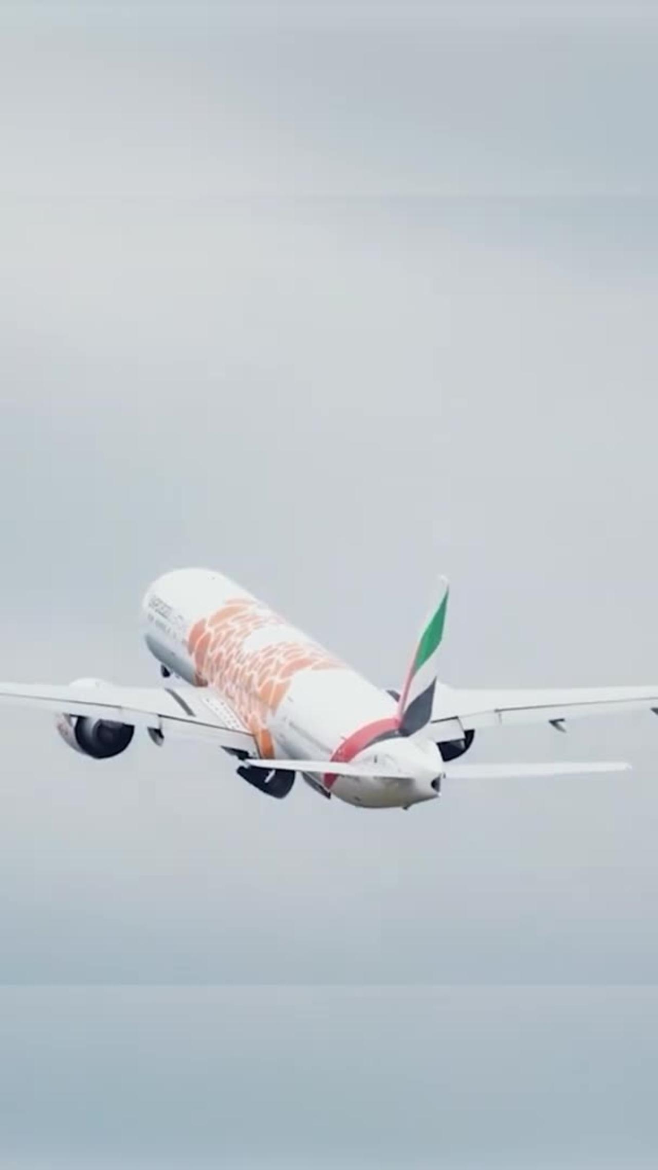 Emirates 777 Orange Expo departing Manchester