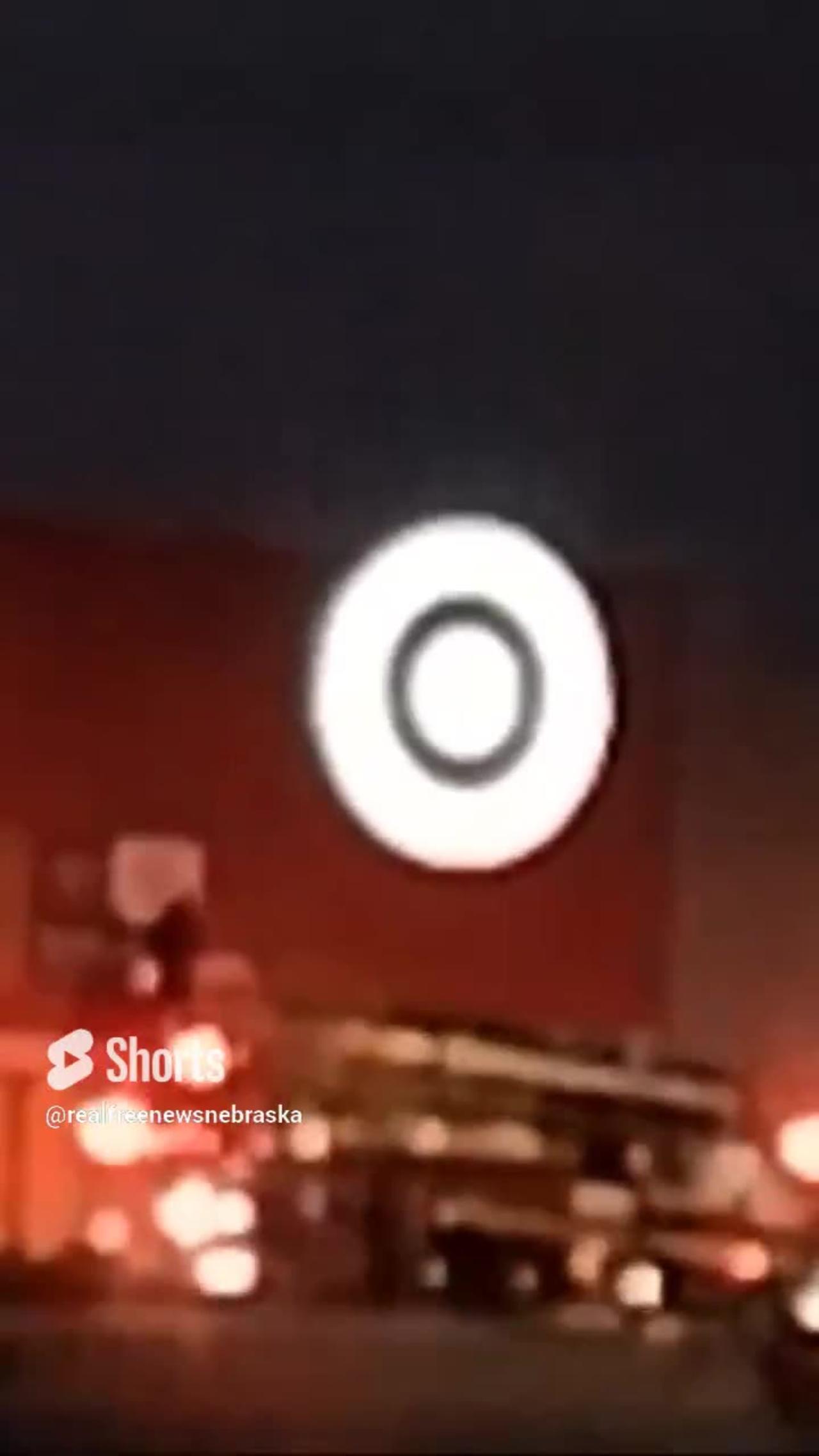 Man let's go of roof and falls to the ground at Target in Omaha Nebraska