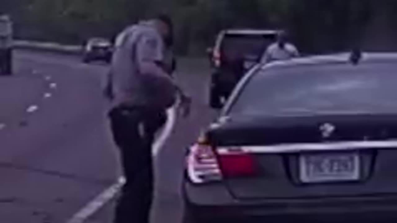 Police man narrowly escape careening BMW car