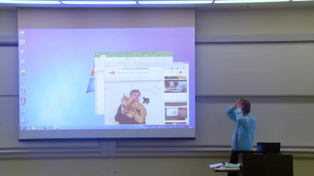 Math professor fixes projector screen (April fool prank)