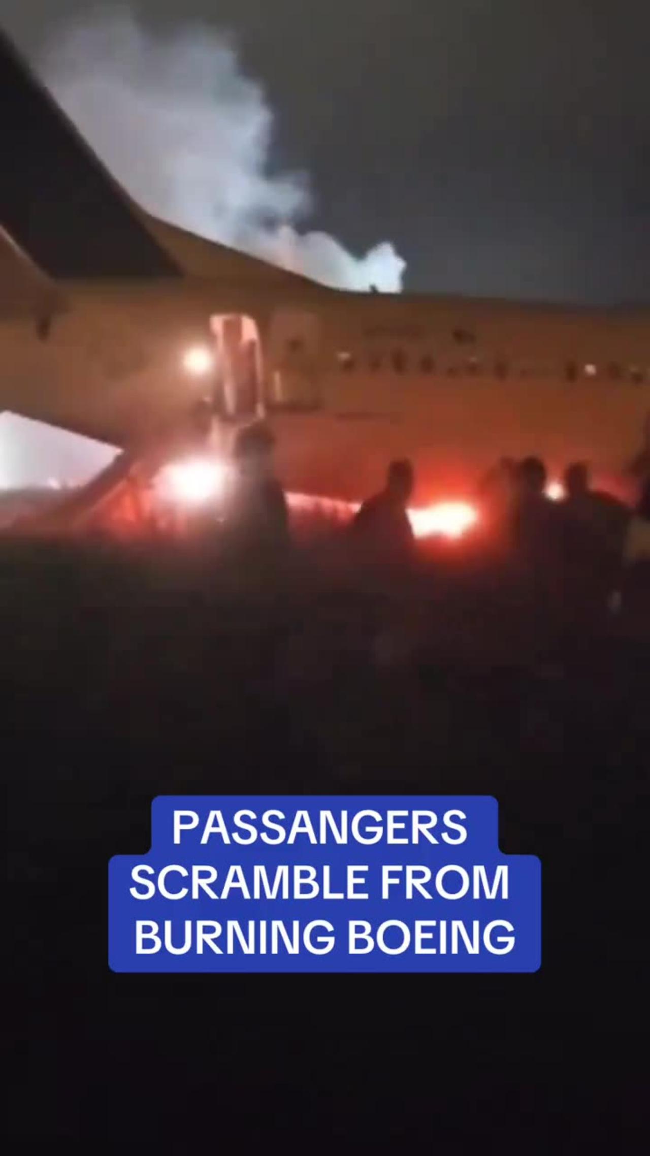 Passengers scramble from burning boeing after a failed takeoff attempt in Senegal