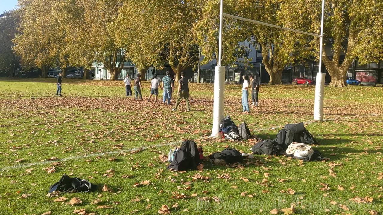 Students Play Touch Rugby on an Autumn Afternoon