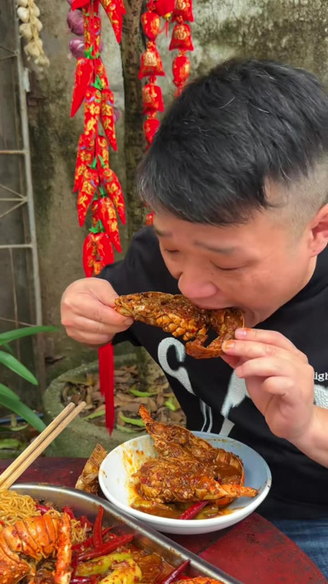 Cook and Eating Spicy Lobster Noodles