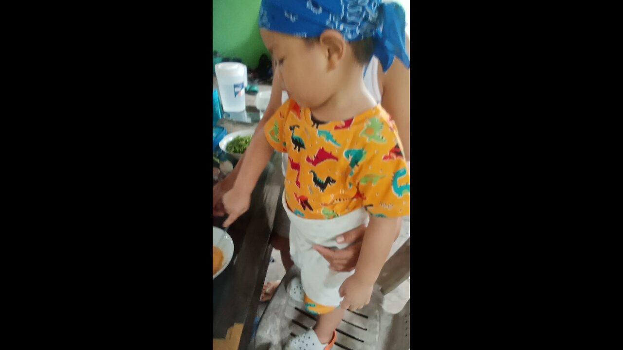 baby Timmy want to cook with Grandma