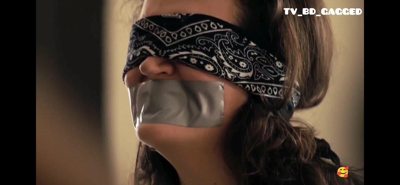 Lockdown. Pretty woman blindfolded and mouth taped
