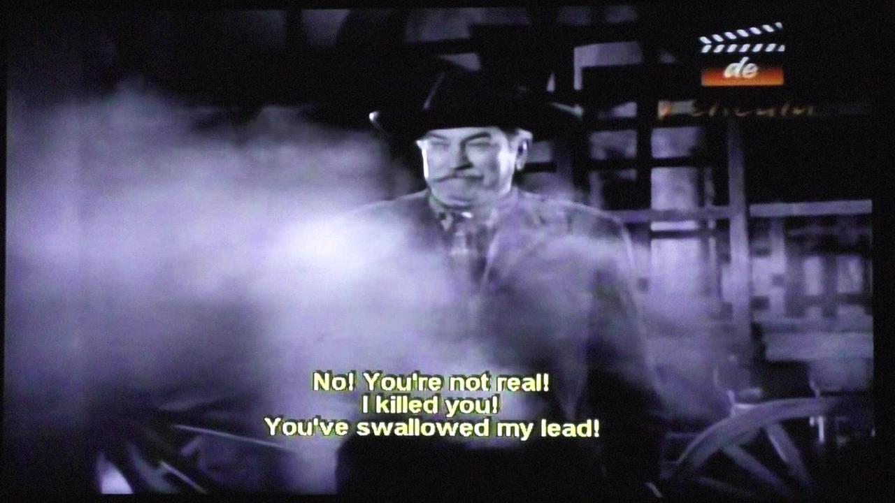 Tusked vampire gunslinger in b/w horror/western "Ghost Town"!
