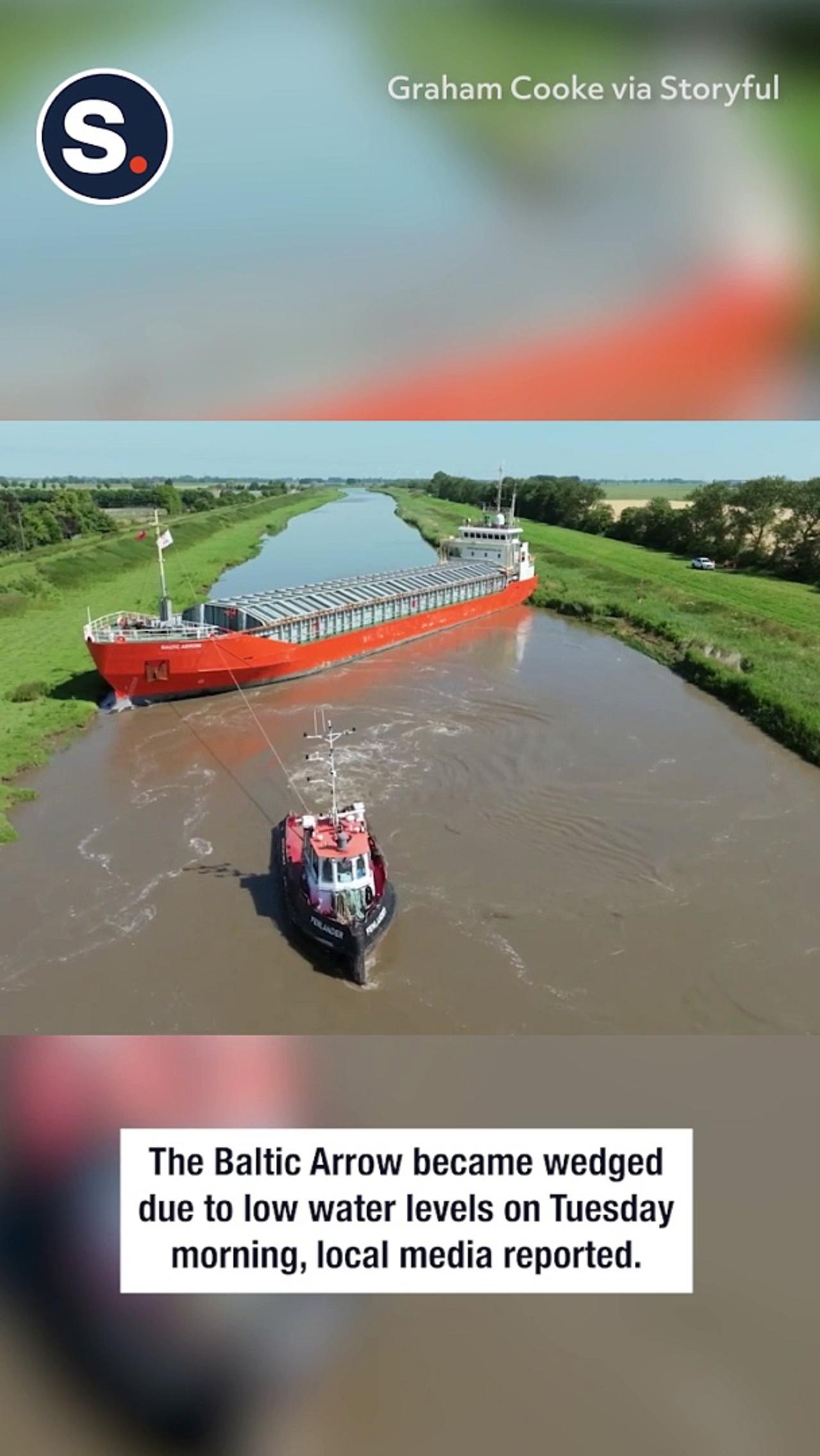 Cargo Ship Wedged in River Nene Freed by Tugboats