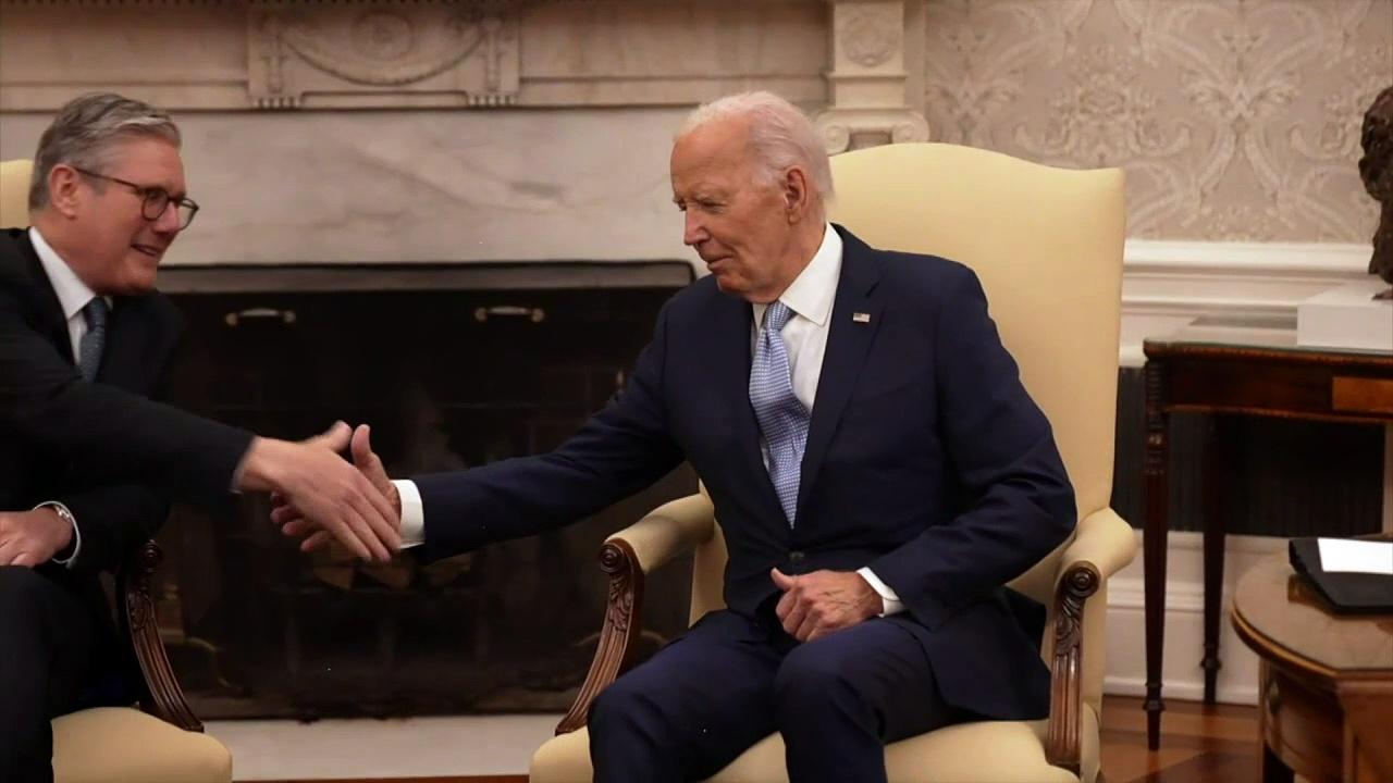 PM and President Biden joke about football
