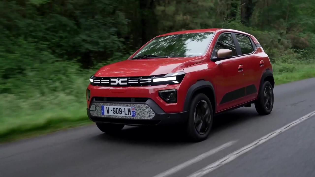 New Dacia Spring in Brick Red Driving Video