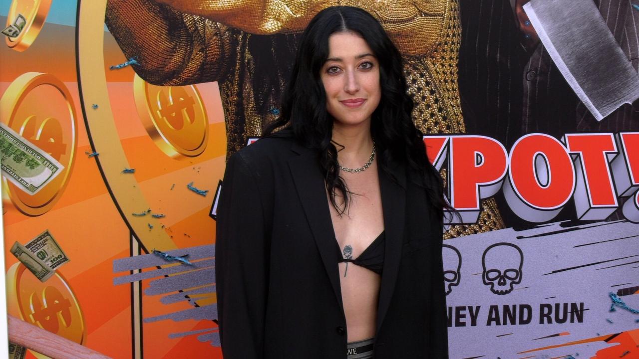 Taylor Ortega attends the red carpet world premiere of Jackpot!