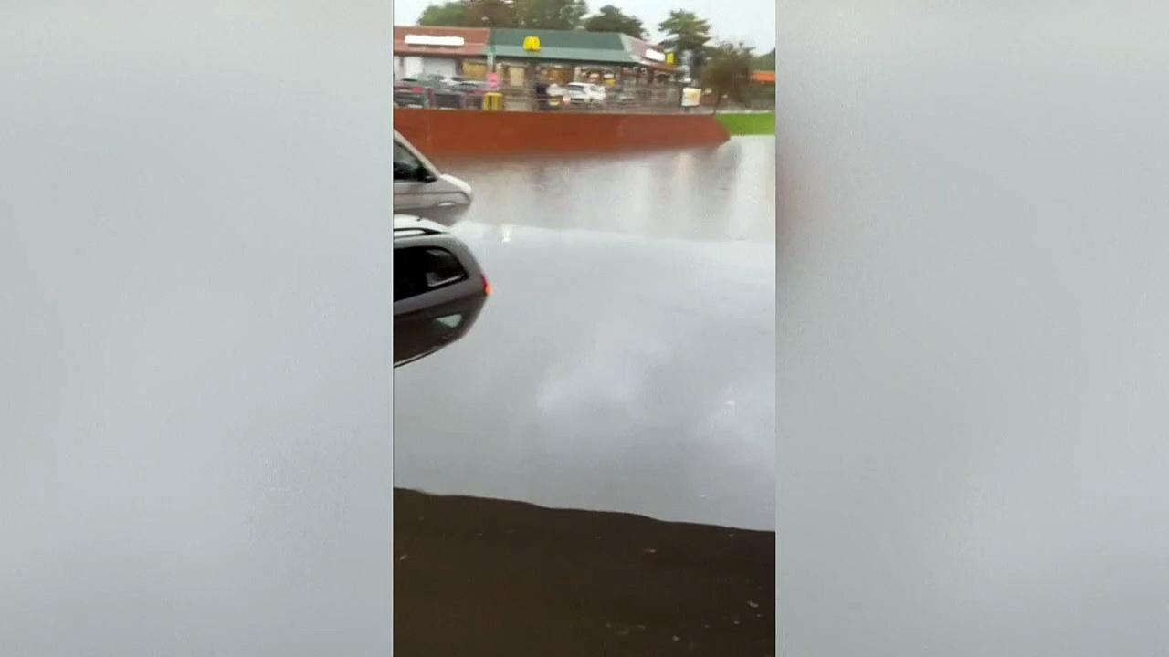 Vehicles underwater as flooding hits southern UK