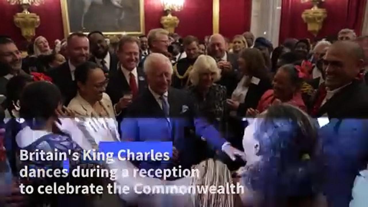 Britain's King Charles dances at Commonwealth reception in London