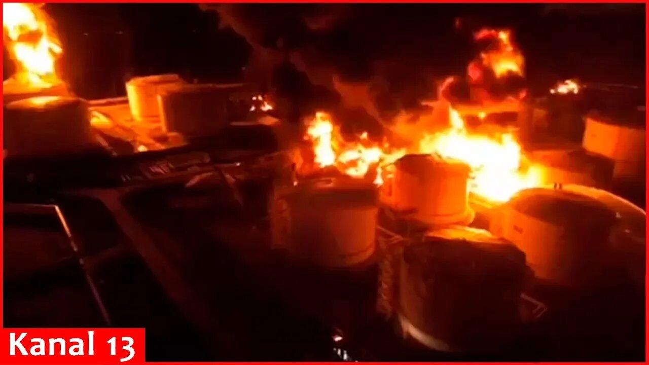 Footage of intense fire in oil tanks following a strike on an oil terminal in Crimea