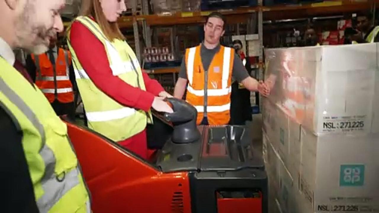 Deputy PM shows off forklift truck driving skills