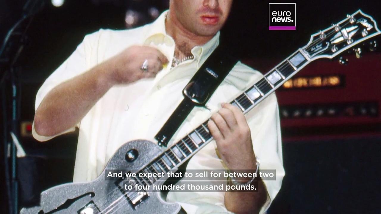 Oasis memorabilia auction to feature Noel Gallagher’s silver sparkle guitar and Liam’s tambour