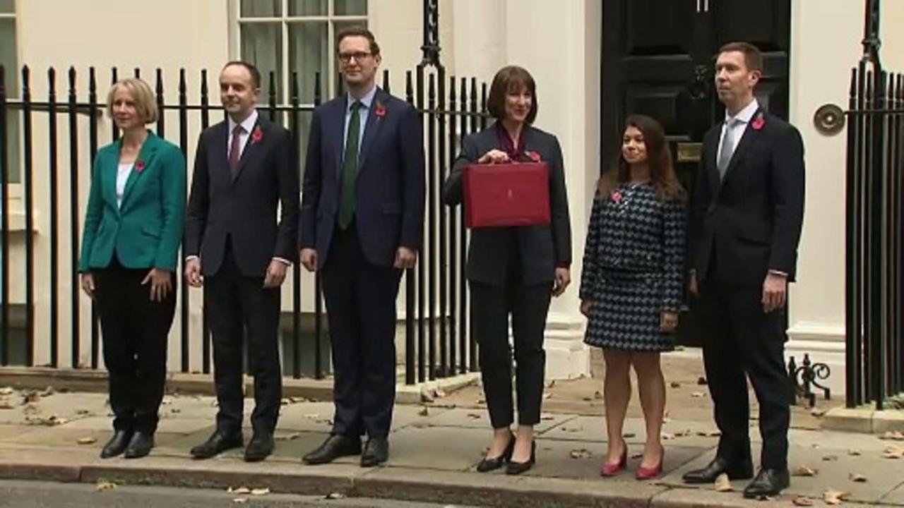 Chancellor poses for traditional red box picture