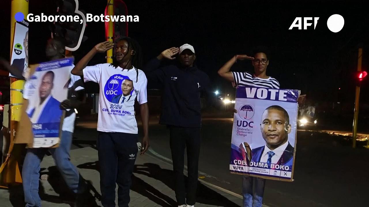 People in Botswana capital celebrate after opposition party win