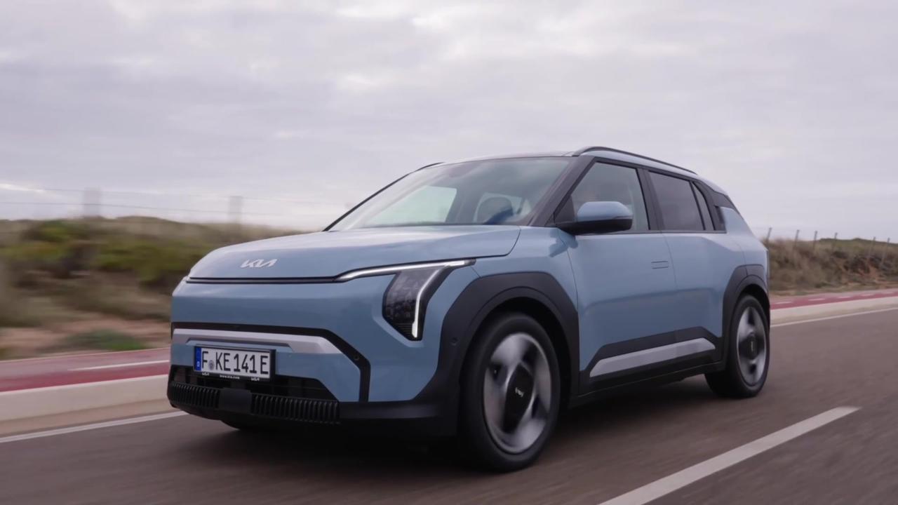 Kia EV3 Baseline Frost Blue Driving in the city