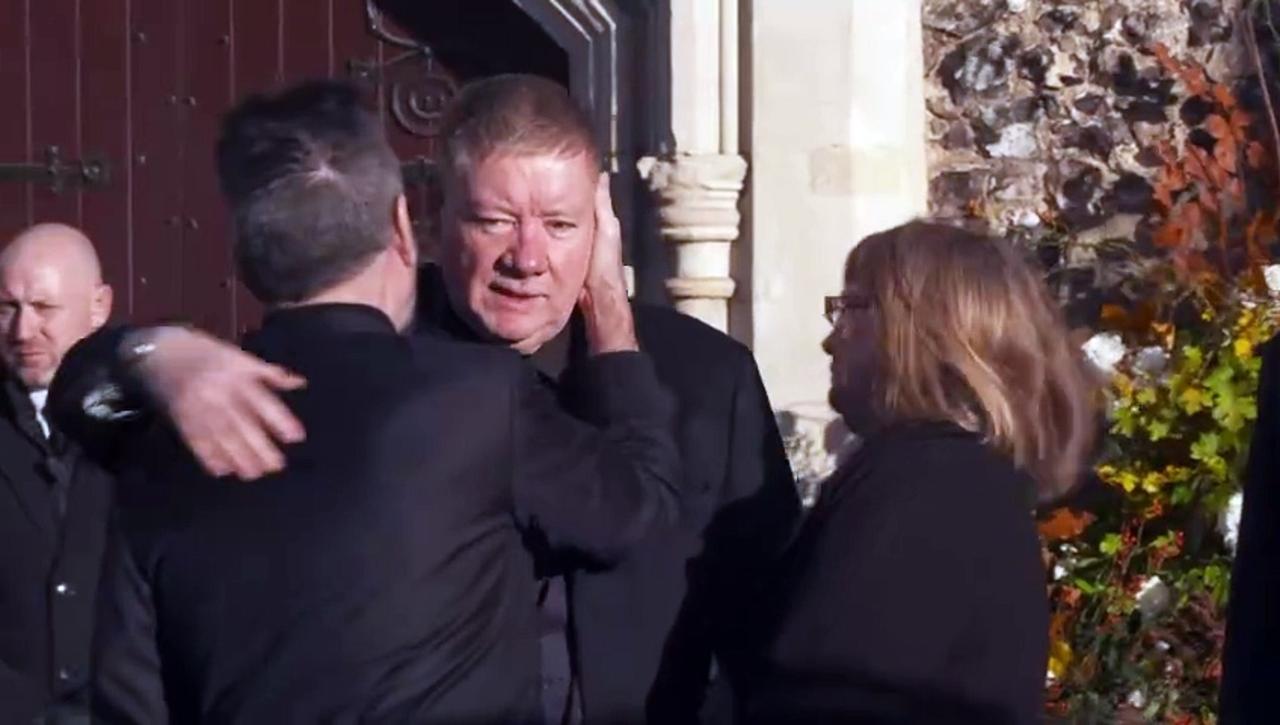 Simon Cowell hugs Geoff and Karen Payne