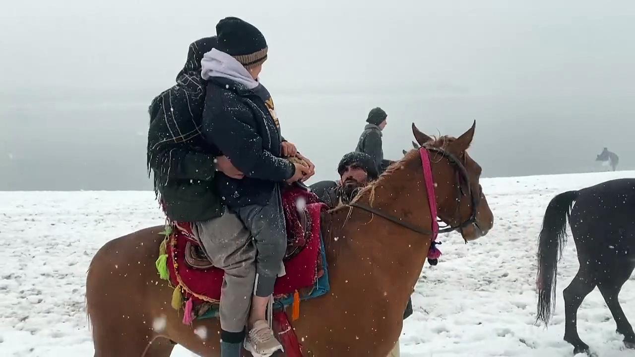 People enjoy first snow outside Afghan capital